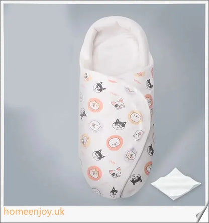 A cozy, snug baby swaddle with soft cotton fabric and velcro closures to provide comfort and security for newborns.
