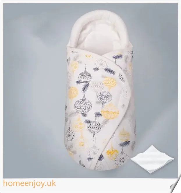 A cozy, snug baby swaddle with soft cotton fabric and velcro closures to provide comfort and security for newborns.