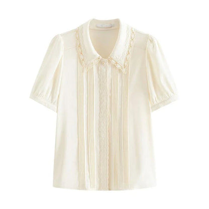 Elegant summer embroidered polo-neck blouse with petal sleeves in ivory colour