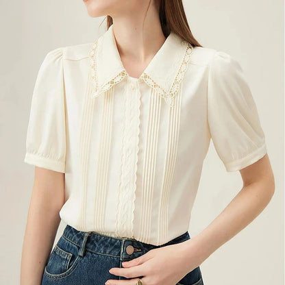 Elegant summer embroidered polo-neck blouse with petal sleeves in ivory colour
