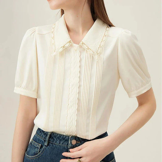 Elegant summer embroidered polo-neck blouse with petal sleeves in ivory colour