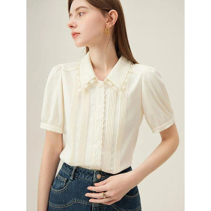 Elegant summer embroidered polo-neck blouse with petal sleeves in ivory colour