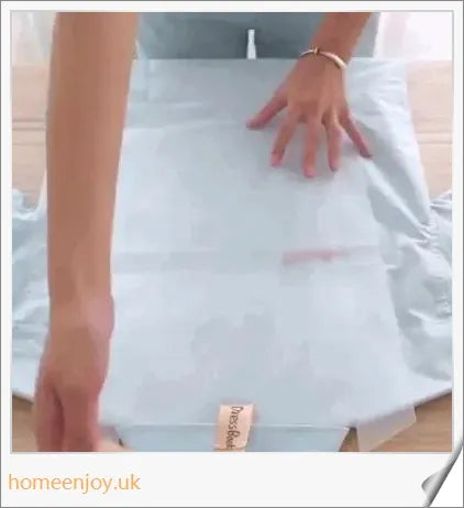 Dress Book - a space-saving clothes folder organizer that helps tidy up your wardrobe and prevent wrinkles in your luggage