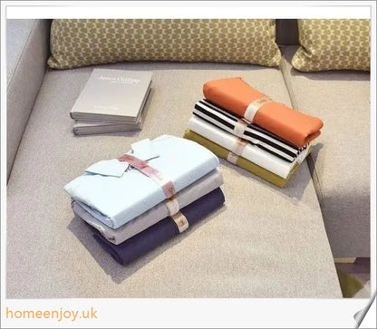 Dress Book - a space-saving clothes folder organizer that helps tidy up your wardrobe and prevent wrinkles in your luggage