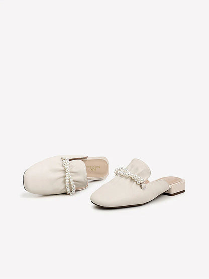 Premium cow leather slippers with square-shaped toe and pearl decorations, designed for comfortable and stylish everyday wear