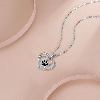 Women's dog paw print necklace with heart-shaped copper pendant on cross chain