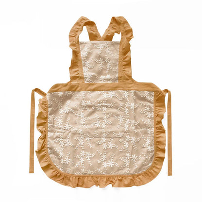 Cotton linen kitchen apron with lace-trimmed X straps in solid colour