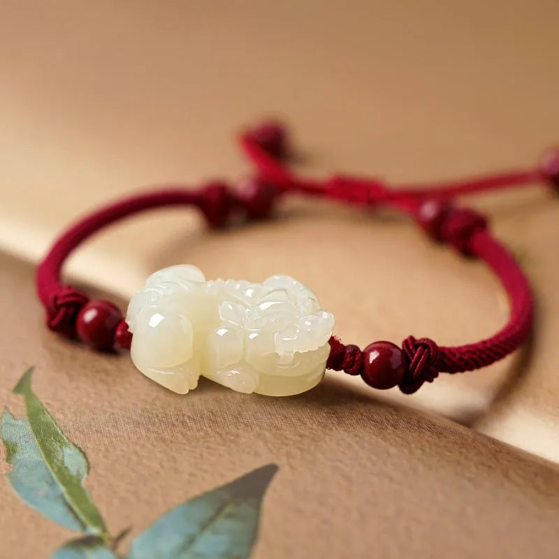 Hetian jade bracelet with black and red adjustable ropes in traditional Chinese design