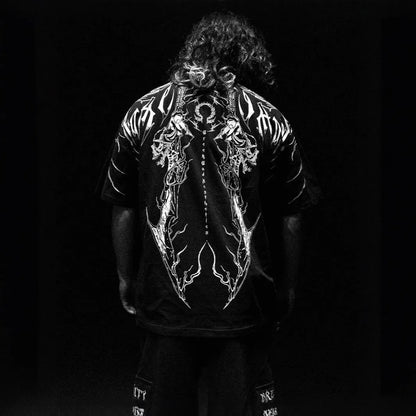 Man wearing a dark loose-fitting plus-size cotton short-sleeved T-shirt with gilding details.
