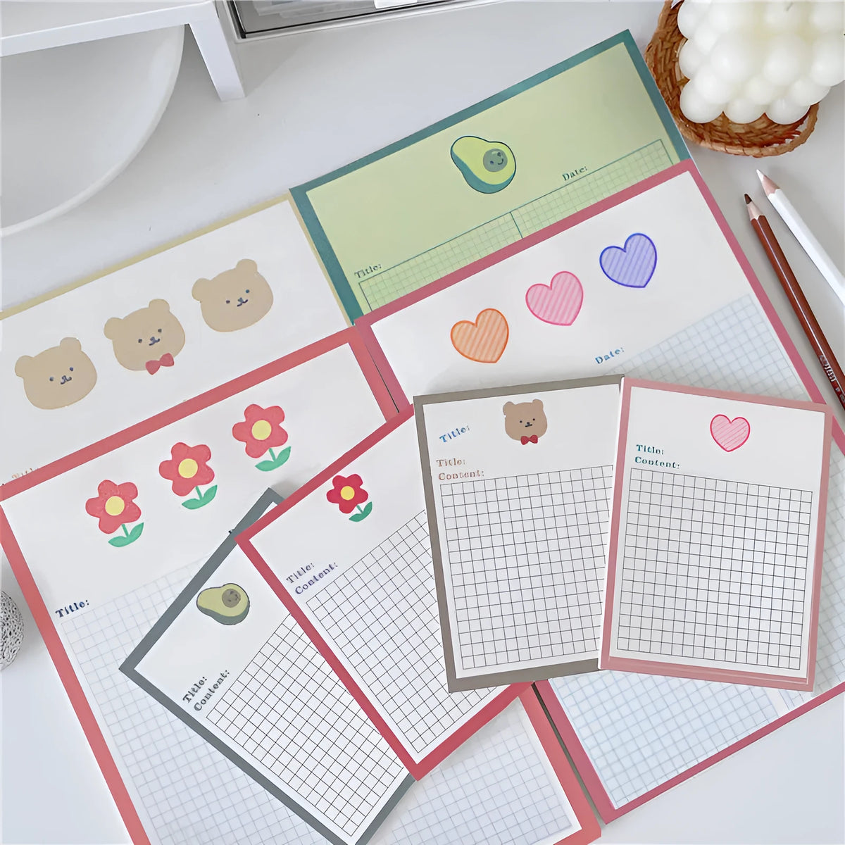 Cartoon design sticky note pads in avocado, bear, love heart, or small flower themes showing two size options