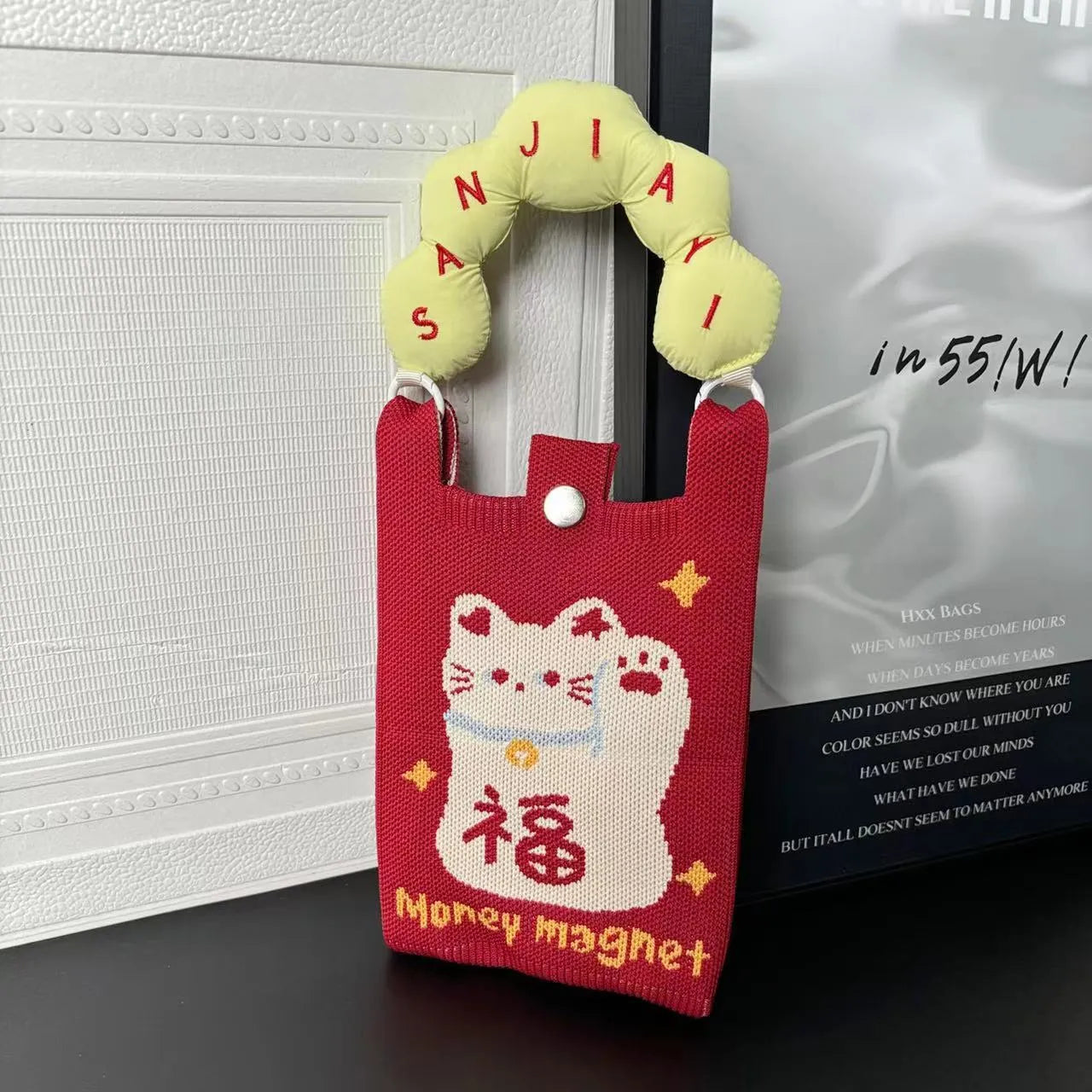 Cartoon knitted messenger bag with polyester construction and internal mobile phone storage