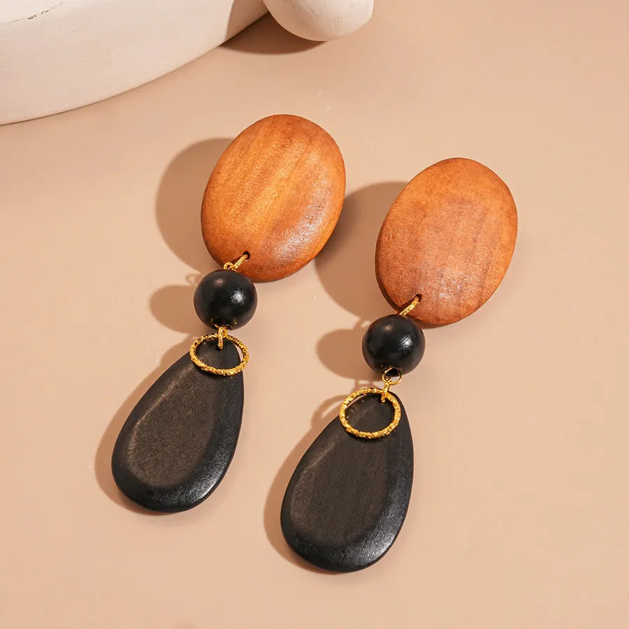 Handmade wooden elliptical earrings in silver brown black colour retro fashion design
