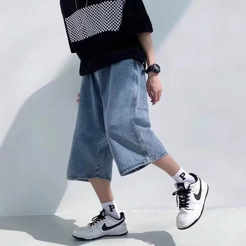 Men's blue washed denim shorts with high waist and cropped straight-leg design on a neutral background