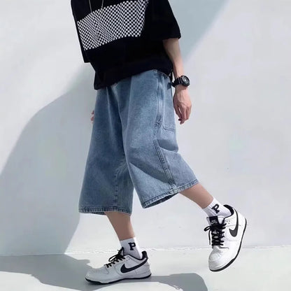 Men's blue washed denim shorts with high waist and cropped straight-leg design on a neutral background