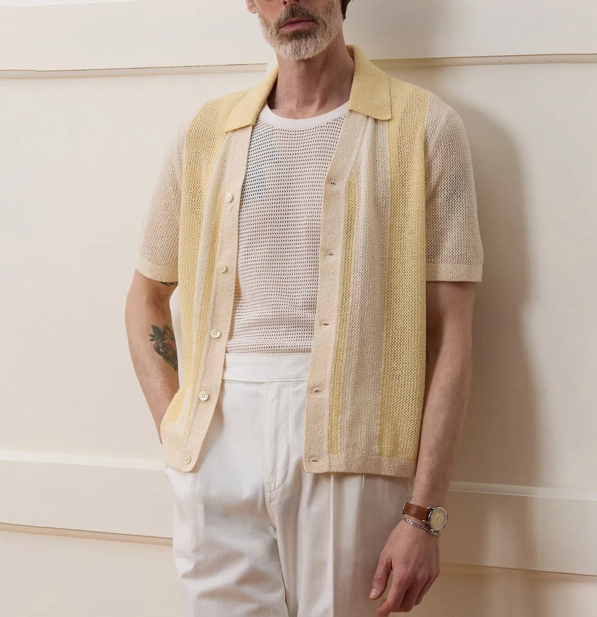 Yellow men's casual polo shirt with a hollow-out asymmetric design on the front.
