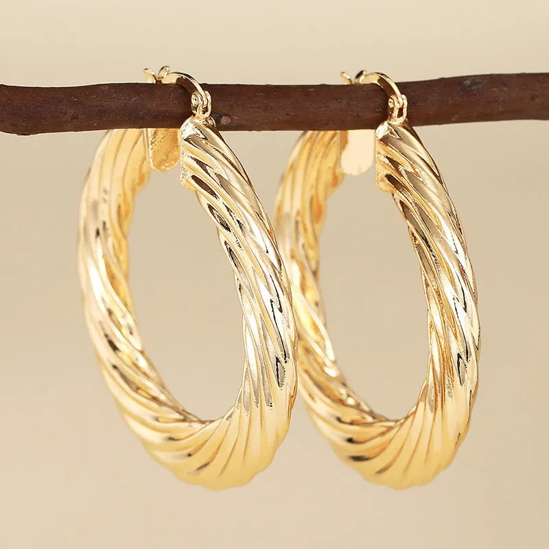 Geometric ring design ear clips for women with drop-shaped copper construction and electroplated finish