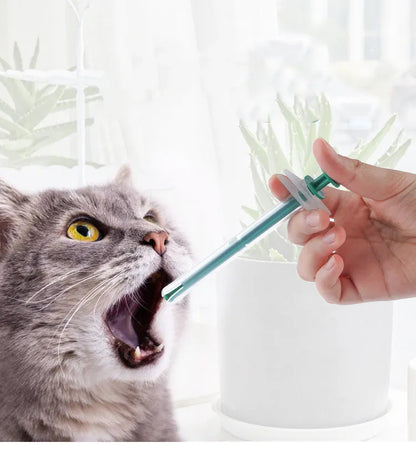 Two silicone-tipped pet pill shooter syringes for cat and dog medicine.