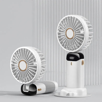 Blue foldable mini handheld electric fan showing its LED display and hanging lanyard.