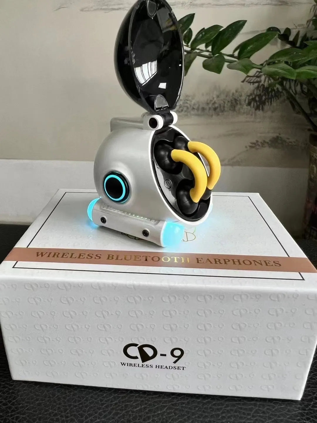 Black and white clip-on Bluetooth wireless sports headset showing ear clip design