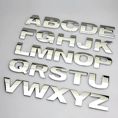 Metal zinc alloy car bumper sticker letters showing 3D design in black and silver finishes