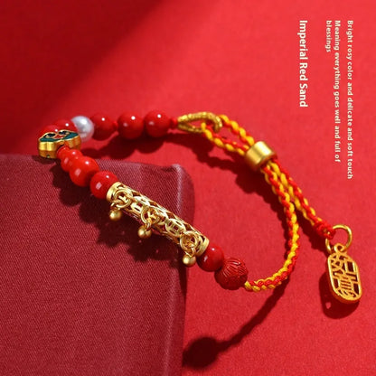 Women's hand-woven cinnabar bracelet with bell design in emperor red sand colour on red rope cord