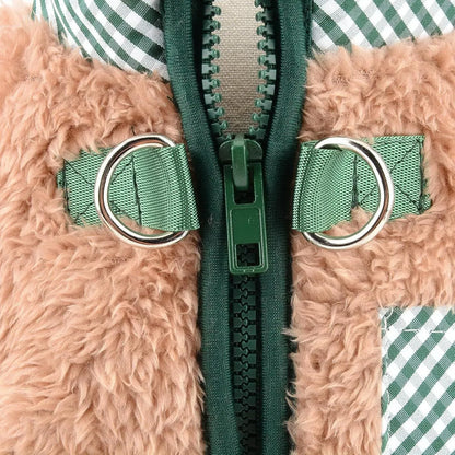 Green plush fleece dog jumpsuit on a small dog, showing the four-leg design and back zipper with D-ring.