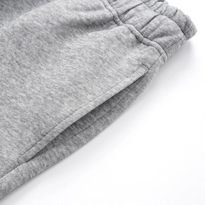 Men's solid colour cotton straight-leg loose casual trousers in grey and black.