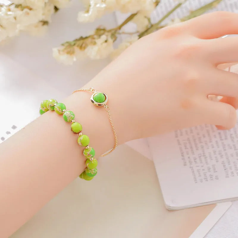 Double-layer women's bracelet with lucky beads and colourful crystals in gold-toned setting