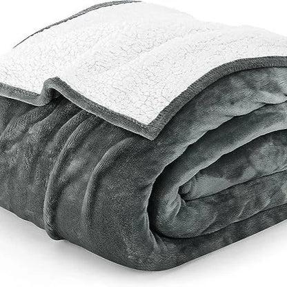 Light grey cotton electric blanket showing adjustable controls, displayed in a home setting.
