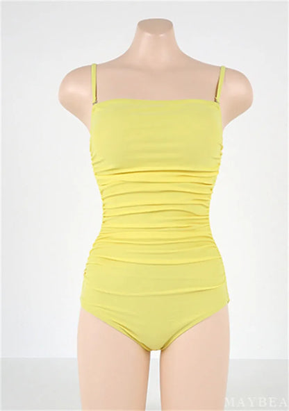 Sling style one-piece swimsuit with belly pleats in solid colour options