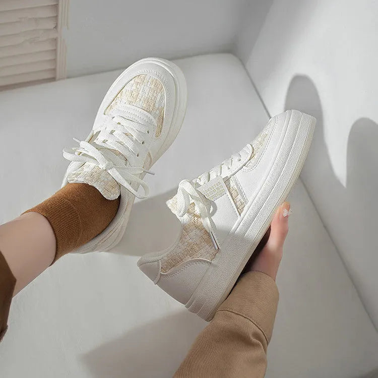 Beige and plaid patterned platform sports shoes with round toe and white rubber sole.