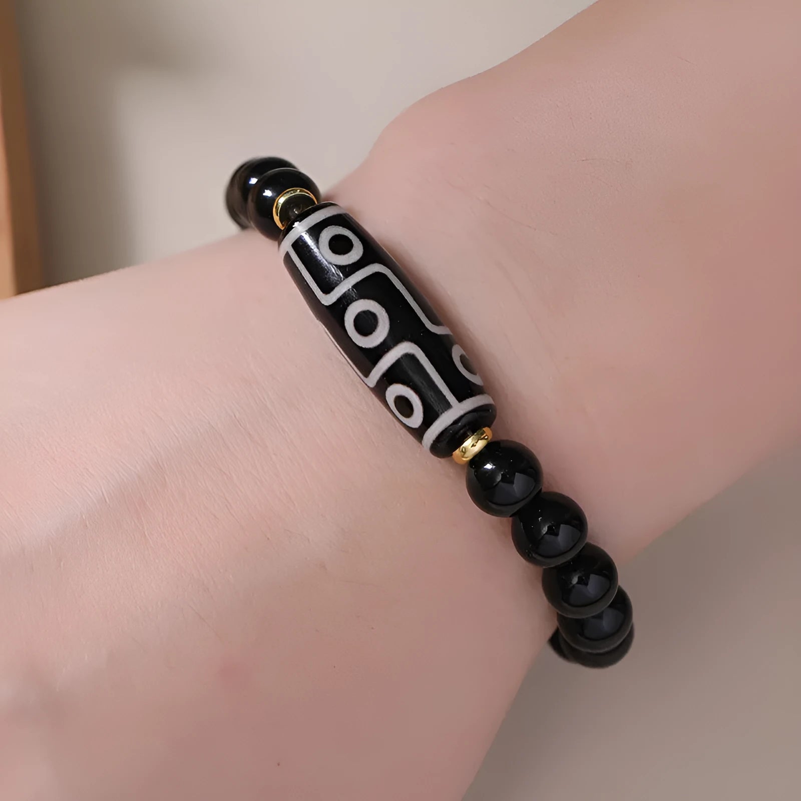 Obsidian-coloured agate Tibet dzi bead bracelet with traditional ethnic design