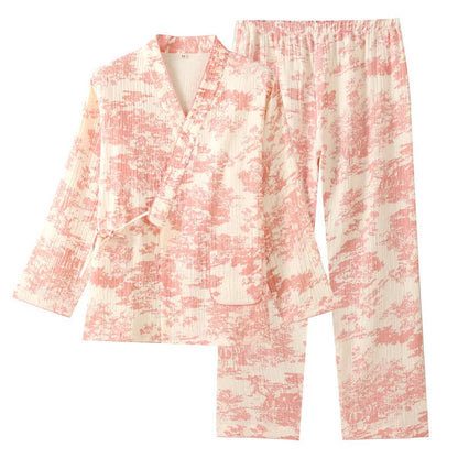 Women's pink pure cotton gauze lace-up top and trousers homewear set laid flat.
