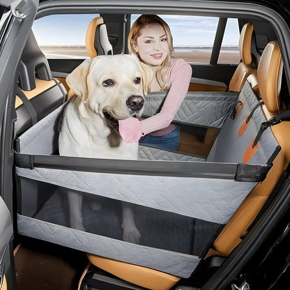 Grey water resistant rectangular dog bed with raised sides on a car back seat.