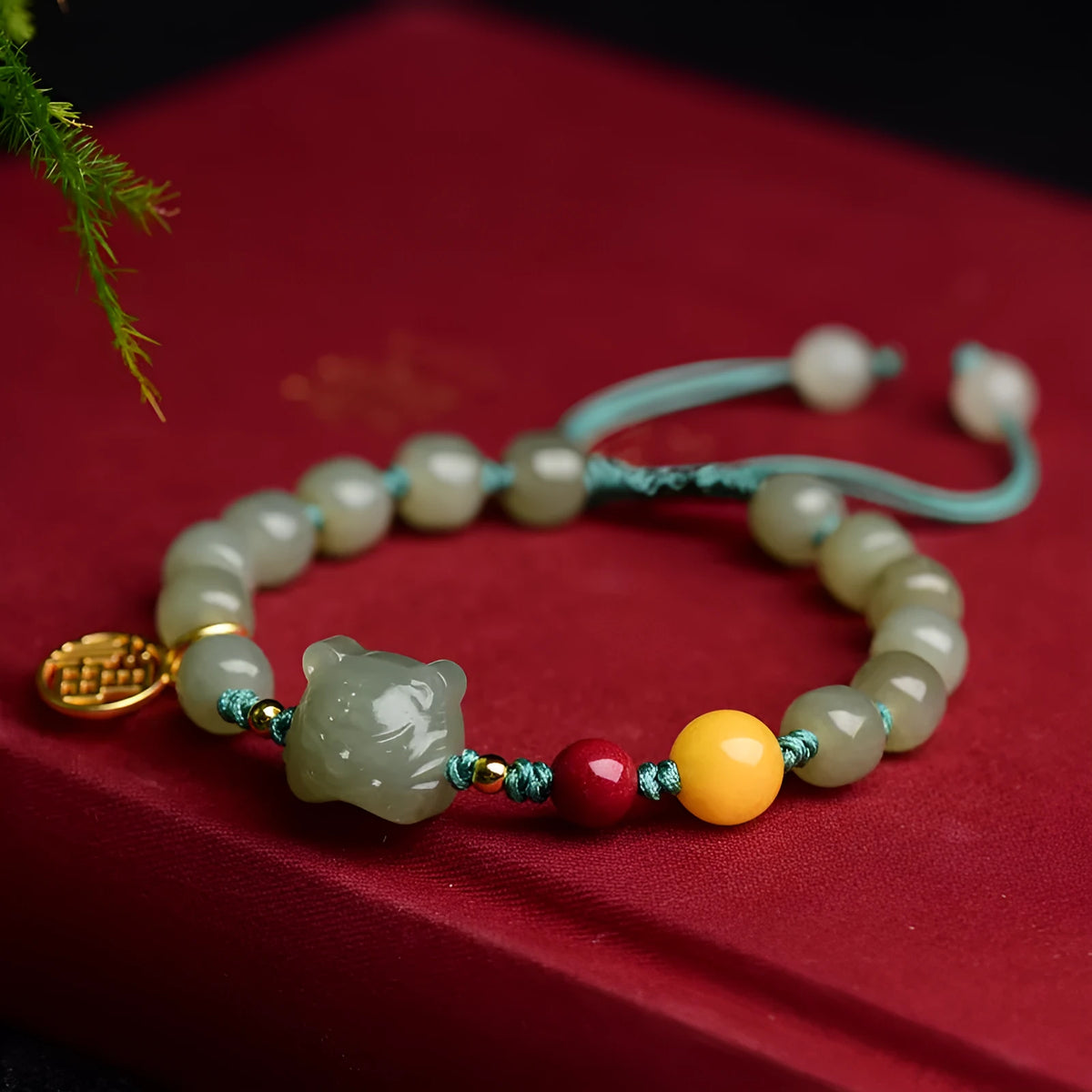 Natural Hetian Jade bracelet with animal Zodiac designs and cinnabar beeswax accents