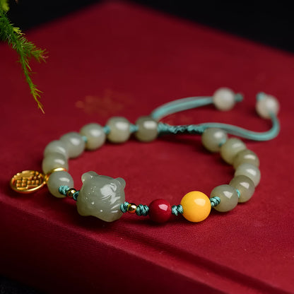 Natural Hetian Jade bracelet with animal Zodiac designs and cinnabar beeswax accents