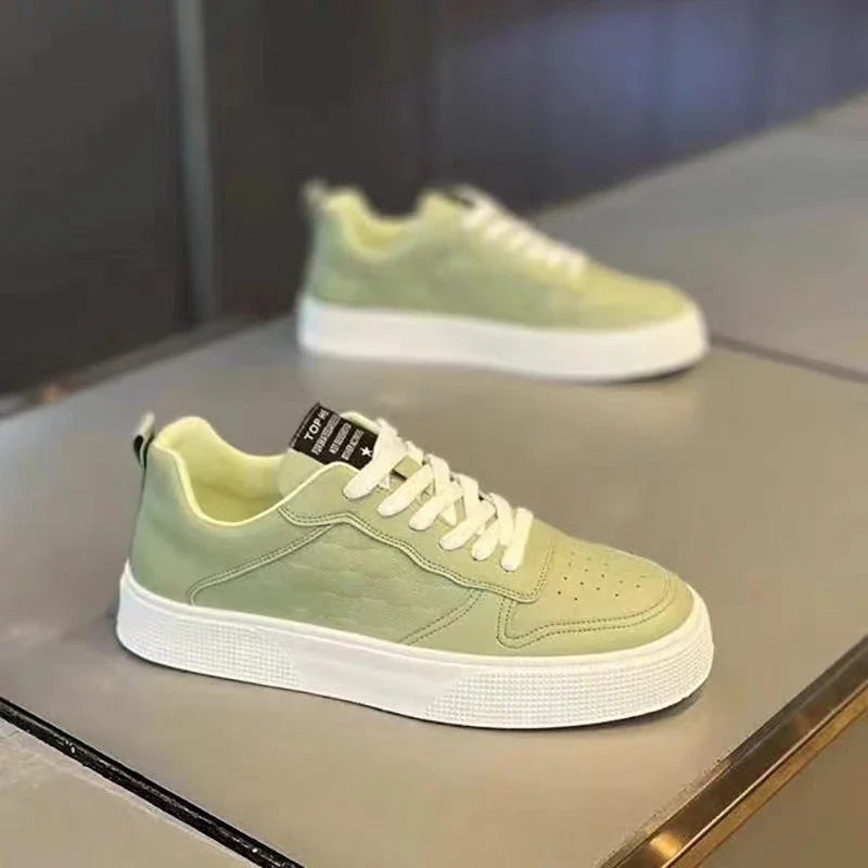 Stylish lace-up sneakers for men in various colors, featuring breathable mesh lining and comfortable rubber sole