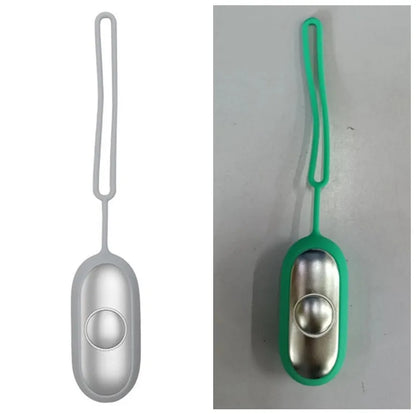 Hand-held micro-current sleep aid device in grey, green, or orange with round button and USB charging port