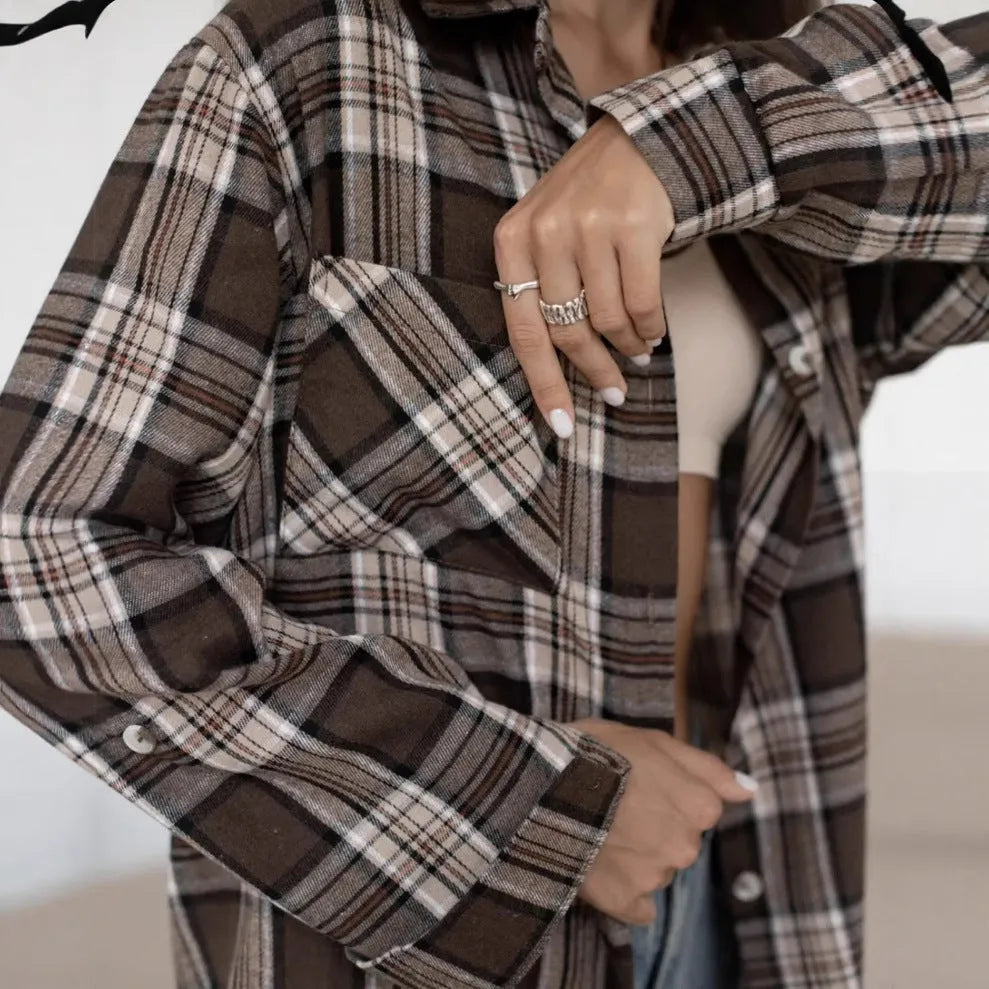 Dark brown striped long sleeve women's shirt with retro collage stitching detail on the front.