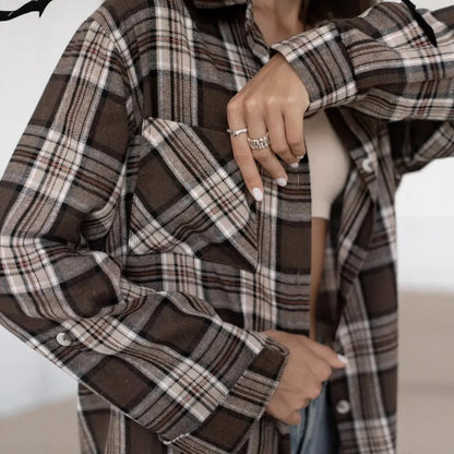Dark brown striped long sleeve women's shirt with retro collage stitching detail on the front.