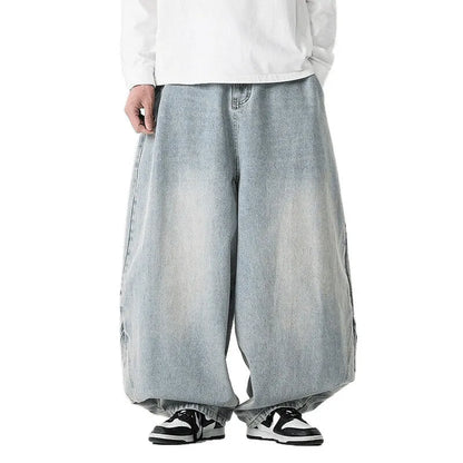 Men's plus-size light blue wide-leg baggy jeans on a neutral background.