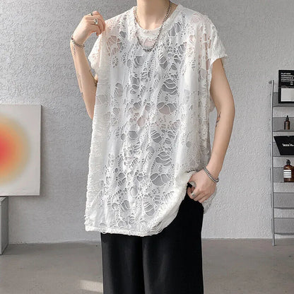 Black loose-fit sleeveless vest with ripped detail and wide shoulders, showcasing Japanese retro style.