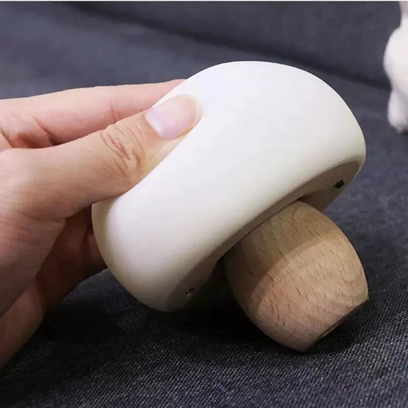 White silicone mushroom-shaped LED night light with a wooden base and touch control.