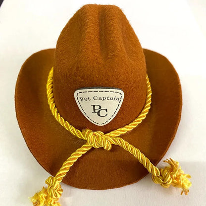 British cowboy hat for a cat on a stand, showing brown non woven fabric with a black ribbon trim.