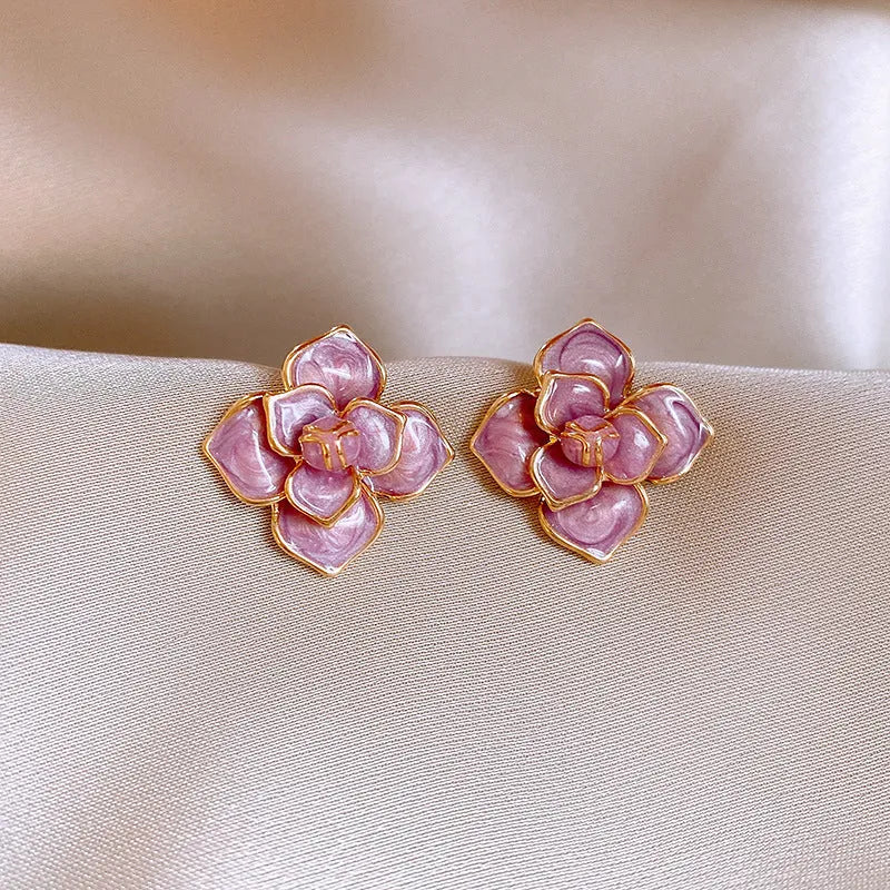 Gold plated purple floral stud earrings with oil-spot glaze on copper