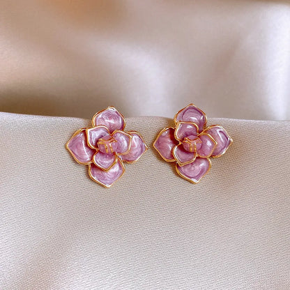 Gold plated purple floral stud earrings with oil-spot glaze on copper