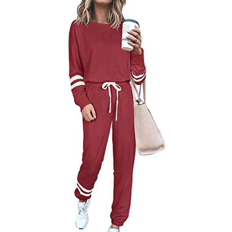 Women's loose-fitting plus size casual suit in a cotton blend, shown in a solid colour with a half-sleeve top and trousers.
