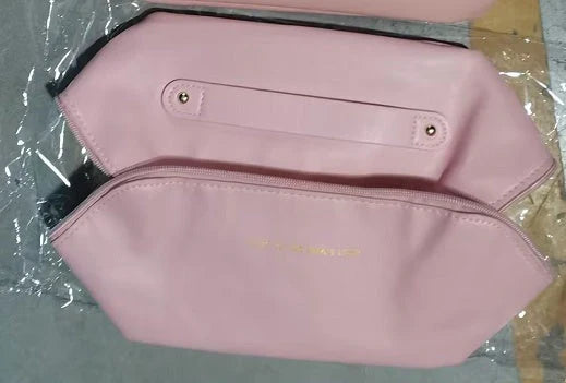 Premium PU leather cosmetic bag with large capacity, versatile storage, and water-resistant design for modern women on the go