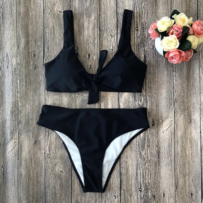 Solid colour bikini top and bottom in seamless polyester fabric on a neutral background.