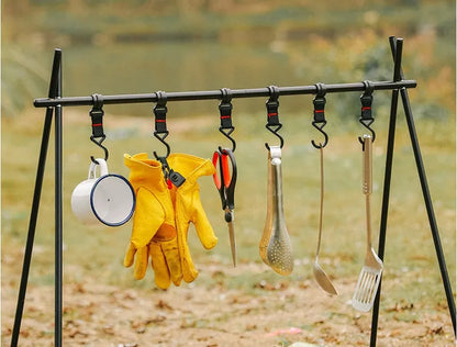 Aluminium alloy folding clothes drying rack with triangle frame and side hanger hooks for camping.